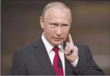  ??  ?? Russian President Vladimir Putin gestures on May 29 during a news conference with French President Emmanuel Macron at the Palace of Versailles, near Paris.