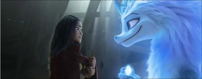  ??  ?? DISNEY+ Raya (voiced by Kelly Marie Tran) and dragon Sisu (Awkwafina) share an adventure in “Raya and the Last Dragon.”