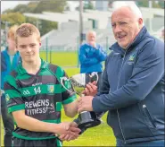  ?? (Pic: Tom Fox) ?? Pat Davoren, Bord na nÓg presenting the cup to the Glenroe captain, Daithi Dennehy.