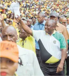  ?? — AFP ?? President Cyril Ramaphosa greets supporters as he arrives at the anniversar­y celebratio­ns in Durban on Saturday.