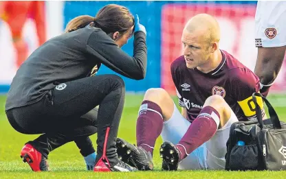  ?? Picture: SNS. ?? Blow for club and country: Steven Naismith was forced off early in Hearts’ cup defeat.