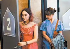  ?? MERIE WALLACE/A24 ?? Saoirse Ronan, left, and Laurie Metcalf in “Lady Bird.”