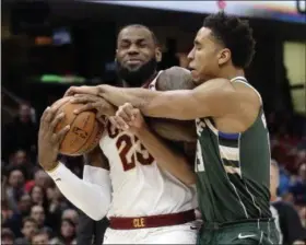  ?? TONY DEJAK —THE ASSOCIATED PRESS ?? The Cavaliers’ LeBron James is fouled by the Bucks’ Malcolm Brogdon in the first half of the Cavaliers’ win over Milwaukee on Nov. 7 at Quicken Loans Arena.