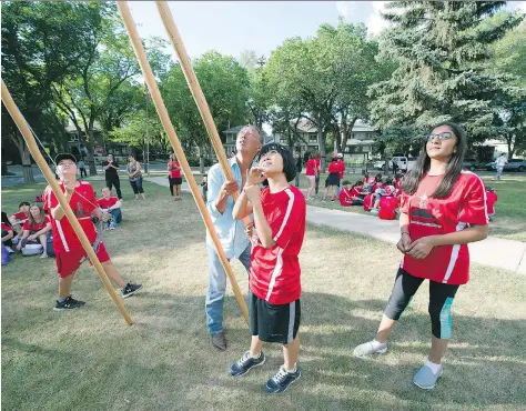  ?? TROY FLEECE ?? Students taking part in the Regina-Fujioka student exchange program learned how to raise a teepee, along with other Indigenous teachings this week. Twenty-five student from Fujioka, Japan, are in Regina for a week. Next year, the Regina hosts will...
