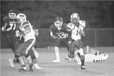  ?? Staff photo by Evan Lewis ?? above New Boston running back Dantray Copeland takes the ball down field as Atlanta lenders close in during the Sept. 23, 2016. game at Rabbit Stadium. Atlanta beat the Lions, 52-0.