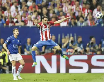  ??  ?? MADRID: Atletico’s Yannick Carrasco leaps to head the ball during the Champions League quarterfin­al first leg soccer match between Atletico Madrid and Leicester City at the Vicente Calderon stadium in Madrid, Spain, yesterday. — AP