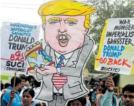  ?? Picture: DIBYANGSHU SARKAR / AFP ?? GO HOME: Activists in India shout slogans and hold a cut-out of US President Donald Trump as they protest in Kolkata against his visit to India on Tuesday.