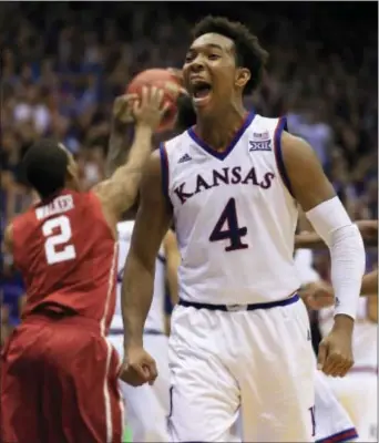  ?? ORLIN WAGNER — THE ASSOCIATED PRESS ?? Kansas guard Devonte’ Graham (4) celebrates at the end of Monday’s game against Oklahoma in Lawrence, Kan.. Kansas defeated Oklahoma 109-106 in triple overtime.