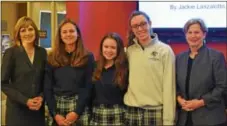  ??  ?? Notre Dame’s Principal, Jacqueline Coccia, left, and President Judith Dwyer, right, discuss a project with, from left, junior Jackie Lanzalotto and sophomores Caroline Voegele and Sophia Skorup during STEM Day.
