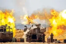  ?? AP PHOTO/YONATAN SINDEL ?? An Israeli artillery unit fires toward targets in Gaza Strip, at the Israeli Gaza border, on Wednesday.