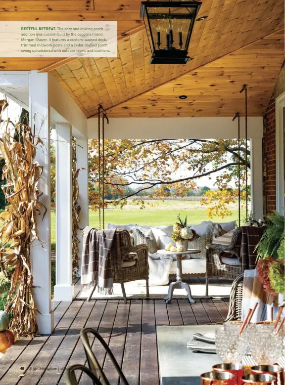  ??  ?? RESTFUL RETREAT. The cozy and inviting porch addition was custom built by the couple's friend, Morgan Shaver. It features a custom-stained deck, trimmed millwork posts and a cedar daybed porch swing upholstere­d with outdoor fabric and cushions.