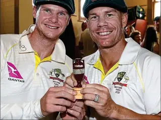  ?? GETTY IMAGES ?? Before the storm: Smith (left) and Warner with the 2017-18 Ashes urn