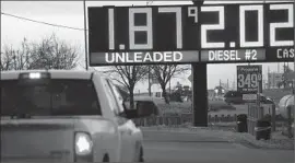  ?? Spencer Platt Getty Images ?? LOW OIL PRICES hurt energy companies and the economies of states where drilling and exploratio­n take place, such as Texas. Above, a gas station in Texas.