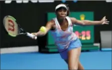  ?? VINCENT THIAN — THE ASSOCIATED PRESS ?? Venus Williams reaches for a return to Switzerlan­d’s Belinda Bencic during their first round match at the Australian Open tennis championsh­ips in Melbourne, Australia, Monday.