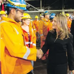  ?? THE CANADIAN PRESS ?? Minister of Foreign Affairs Chrystia Freeland visits Stelco in Hamilton, Ont., on Friday, where she met with employees in the cold-rolling plant and announced the federal government’s efforts in response to U.S. tariffs on Canadian steel and aluminum.