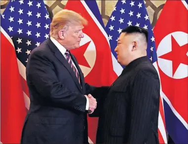  ??  ?? President Donald Trump meets North Korean leader Kim Jong Un on Wednesday in Hanoi, Vietnam. ASSOCIATED PRESS] [EVAN VUCCI/THE