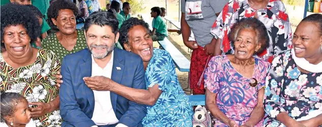  ?? Photo: DEPTFO News ?? The Attorney-General and Minister for Economy, Aiyaz Sayed-Khaiyum, with parents and guardians of Mulomulo Primary School after the prefects induction ceremony on May 16, 2022.