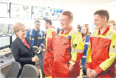  ??  ?? GOOD TO TALK: First Minister Nicola Sturgeon meets staff at Norbord Mill.