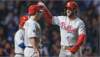  ?? KAMIL KRZACZYNSK­I — THE ASSOCIATED PRESS ?? The Phillies spent big on Bryce Harper and while his bat has been slow to come around the team is in first place.