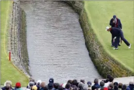  ?? PHIL NOBLE — THE ASSOCIATED PRESS ?? In this file photo, Ireland’s Padraig Harrington looks down to where his ball landed in the Barry Burn during the final round of the British Open Golf Championsh­ip at Carnoustie, Scotland. Carnoustie is known more for the calamity it causes than the British Open champions it produces. Harrington hit into the burn twice on the 18th hole, made double bogey and still won in a playoff.