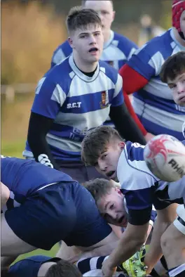  ??  ?? Sligo Grammar player passes to teammate Hubert Gilvarry (No 10) during the ga