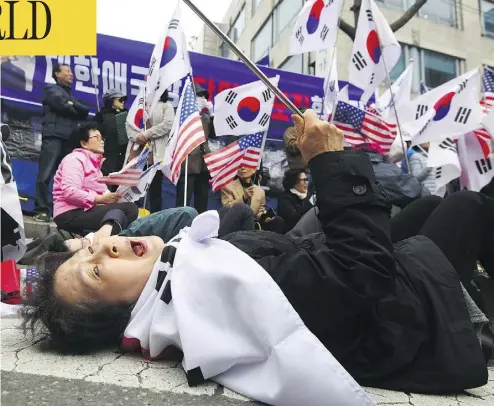  ?? JUNG YEON-JE / AFP / GETTY IMAGES ?? A supporter of South Korea’s former president Park Geun-hye reacts at a rally outside the Seoul Central District Court after Park was sentenced to 24 years in prison on Friday in a high-profile corruption and bribery case.