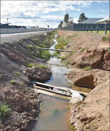  ??  ?? The open drainage area along Botts Road will have undergroun­d pipes installed, a kerb and channel and then filled and landscaped.