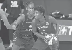  ?? CHRIS O’MEARA/AP ?? Aces forward Angel McCoughtry looks around the Sun’s Alyssa Thomas during the second half of Game 4 of a WNBAsemifi­nal Sunday in Bradenton, Fla.