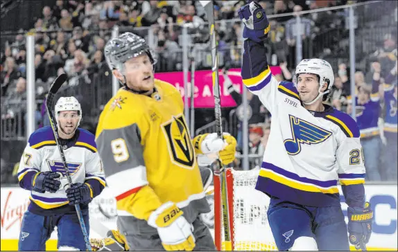  ?? ?? St. Louis Blues left wing Brandon Saad (20) waves to the bench after scoring Saturday as Golden Knights center Jack Eichel skates by.