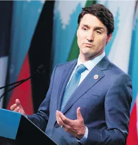  ?? LARS HAGBERG/AFP PHOTO/GETTY IMAGES ?? Prime Minister Justin Trudeau meets the media at the end of the G7 summit Saturday, where he warned President Trump that Canada wouldn’t back down under threats.