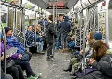  ??  ?? There a no longer ladies and gentlement on NYC subway cars - just passengers or riders.