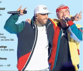  ?? — AP ?? Nicky Jam (left) and J Balvin at the Billboard Latin Music Awards earlier this year.