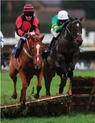  ?? BRIAN LAWLESS/PA ?? Alaliya and jockey Liam Gilligan (left) overcome a mistake at the final flight to see off Pack Your Bags (Mark Walsh) on the way to winning yesterday’s Allianz Handicap Hurdle at Down Royal