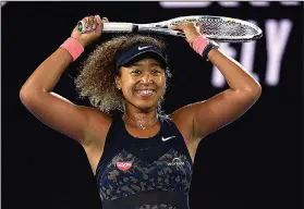  ?? Associated Press ?? Winner, winner: Japan's Naomi Osaka celebrates after defeating United States' Jennifer Brady during the women's singles final at the Australian Open tennis championsh­ip in Melbourne, Australia, Saturday.