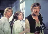  ?? LUCASFILM ?? Mark Hamill, Carrie Fisher and Harrison Ford, young and destined for stardom in 1977’s original Star Wars.