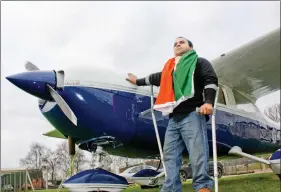  ??  ?? Gautam poses next to an aircraft, a part of the fleet at his not for profit company Freedom in the Air.