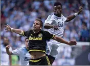  ?? The Canadian Press ?? Vancouver Whitecaps defender Sam Adekugbe, right, seen here in 2015 battling for the ball with Ben Speas of the Columbus Crew, has been loaned to Swedish first division club IFK Goteborg.