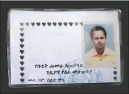  ?? (AP/Nariman El-Mofty) ?? A new ID card issued by Amhara authoritie­s to Seid Mussa Omar, a 29-year-old Tigrayan nurse from Humera, who fled to Hamdayet. Amhara authoritie­s took Omar’s original ID card displaying his Tigrayan ethnicity and burned it, he said. On the new card, traces of Tigray had vanished. It was issued in January in a city so far north in Ethiopia it’s within sight of neighborin­g Eritrea. Yet the card is stamped by authoritie­s of the Amhara region to the south. The language on the card is Amharic, not the Tigrinya of Tigray. Translatio­n from Amharic reads, “Setit Humera General Temporary Work Place Identity — Full Name: Seid Mussa.”