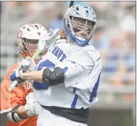  ?? Erik Trautmann / Hearst Connecticu­t Media ?? Darien’s Tanner Strub takes a shot behind his back on the Ridgefield goal on Saturday.