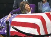  ?? GODOFREDO A. VÁSQUEZ AP ?? Rep. Nancy Pelosi puts her arm around the casket of Sen. Dianne Feinstein on Wednesday in San Francisco.