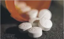  ?? | AP FILE ?? The opioid oxycodone- acetaminop­hen.