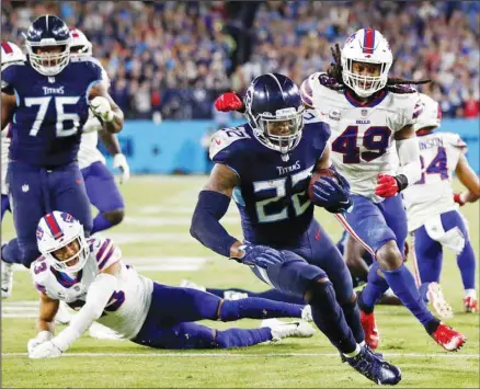  ?? ?? Tennessee Titans running back Derrick Henry (22) scores a touchdown on a 13-yard run against the Buffalo Bills in the second half of an NFL football game in Nashville, Tenn. (AP)