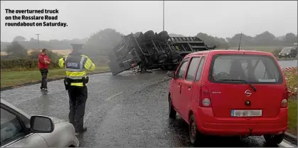  ??  ?? The overturned truck on the Rosslare Road roundabout on Saturday.