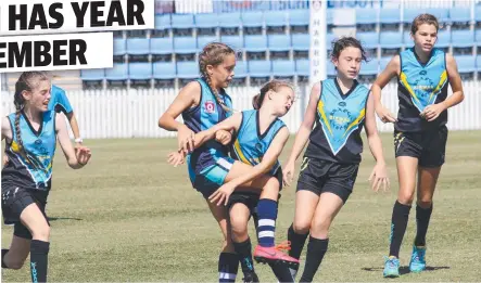  ?? Picture: AFLQ MEDIA ?? FIERCE CONTEST: Kirwan State School's Miley Widt attempts to spoil as Siena Tabacchi, and co-captains Chloe Verhaaf and Baylee Gray watch on in the AFL Queensland Schools Cup North Queensland Championsh­ips in Mackay.