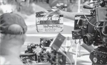  ?? Ricardo DeAratanha Los Angeles Times ?? A CLAPBOARD is used to start a take on the Hollywood Hills set of the movie “The Perfect Guy” in 2014. An enhanced California tax incentive program that took effect in July 2015 has boosted on-location filming.