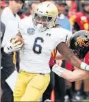  ?? STEPHEN M. DOWELL/TNS ?? Notre Dame running back Tony Jones Jr. is knocked out of bounds by Iowa State linebacker Mike Rose on Saturday.