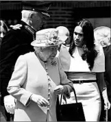  ?? EDDIE MULHOLLAND/DAILY TELEGRAPH ?? Queen Elizabeth II and the Duchess of Sussex walk to the Chester, England, Town Hall on Thursday.