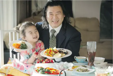  ?? MARK VAN MANEN ?? Dr. Albert Kim, here with daughter Pearl, began his meat-free life in 1998, when he spent six months in a Taiwanese monastery.