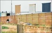  ?? Wally Skalij Los Angeles Times ?? DESIGNS for Trump’s proposed wall are not related to a Border Patrol project in progress, an official said.