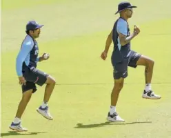  ?? Agence France-presse ?? ↑
India’s captain Shikhar Dhawan (right) with team-mate Prithvi Shaw attends a practice session.